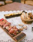 You can relax with an aperitif in a historic building with two glasses of wine, paired with local Trentino specialties such as Speck and Trentingrana cheese.