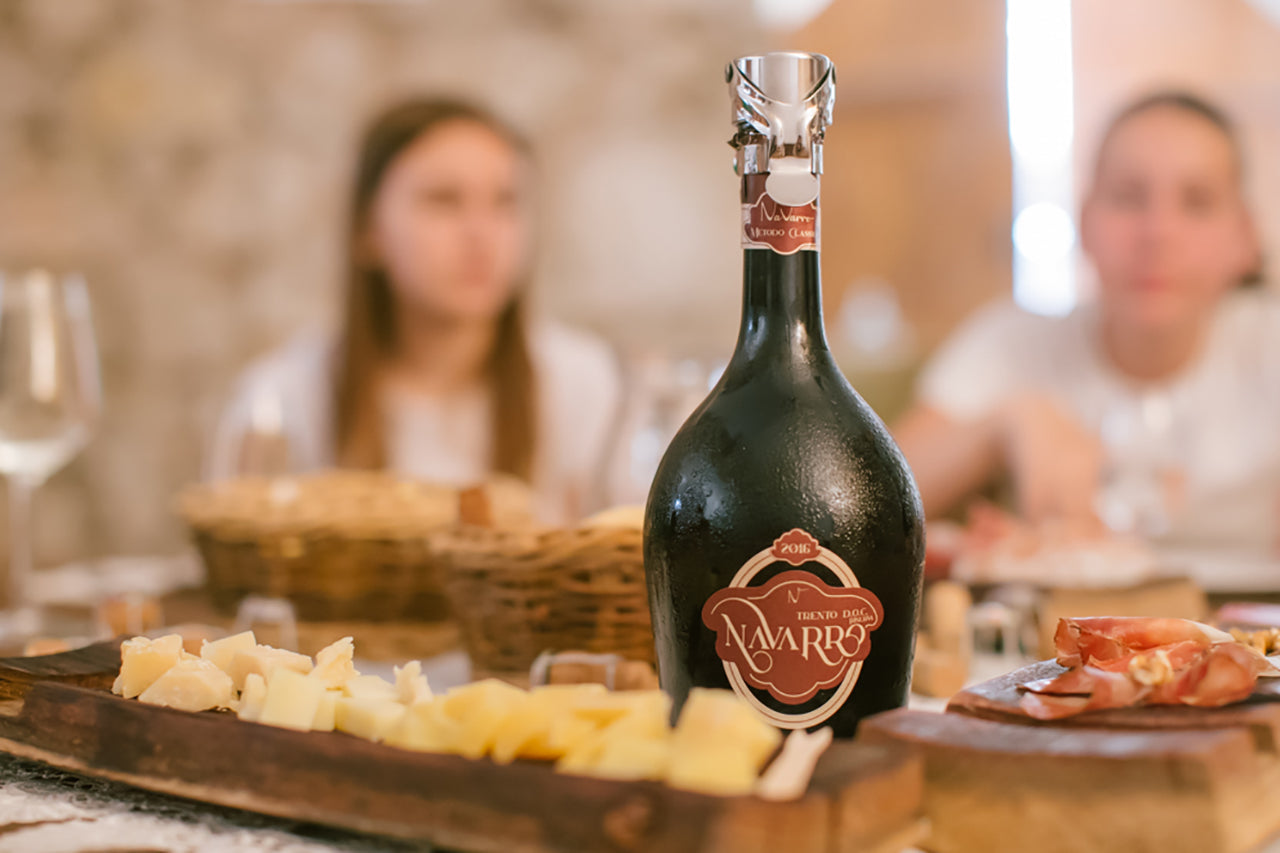 You can relax with an aperitif in a historic building with two glasses of wine, paired with local Trentino specialties such as Speck and Trentingrana cheese.