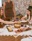 You can relax with an aperitif in a historic building with two glasses of wine, paired with local Trentino specialties such as Speck and Trentingrana cheese.